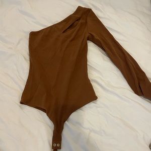 Brown one shoulder body suit with cutout